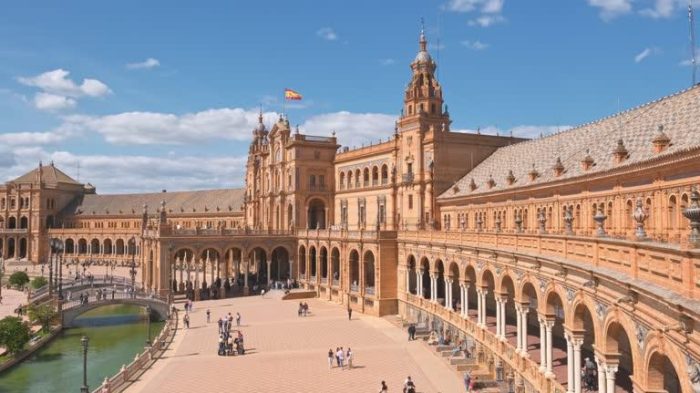 Spanish Square or Plaza de Espana at sunny day in Seville, Spain. View over Plaza de Espana palace in Sevilla, Andalusia, Spain. Slow revealing footage